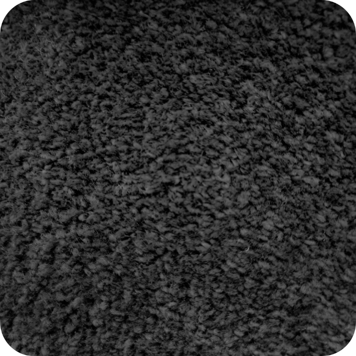 Close-up view of dark gray textured asphalt or concrete surface with rough, granular finish and speckled pattern throughout.
