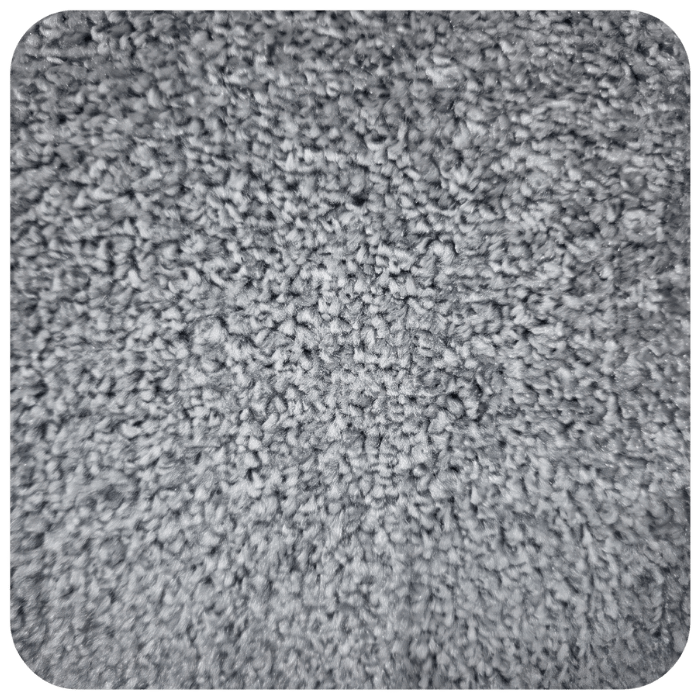 Close-up view of gray textured carpet fibers showing detailed woven pile pattern and surface texture