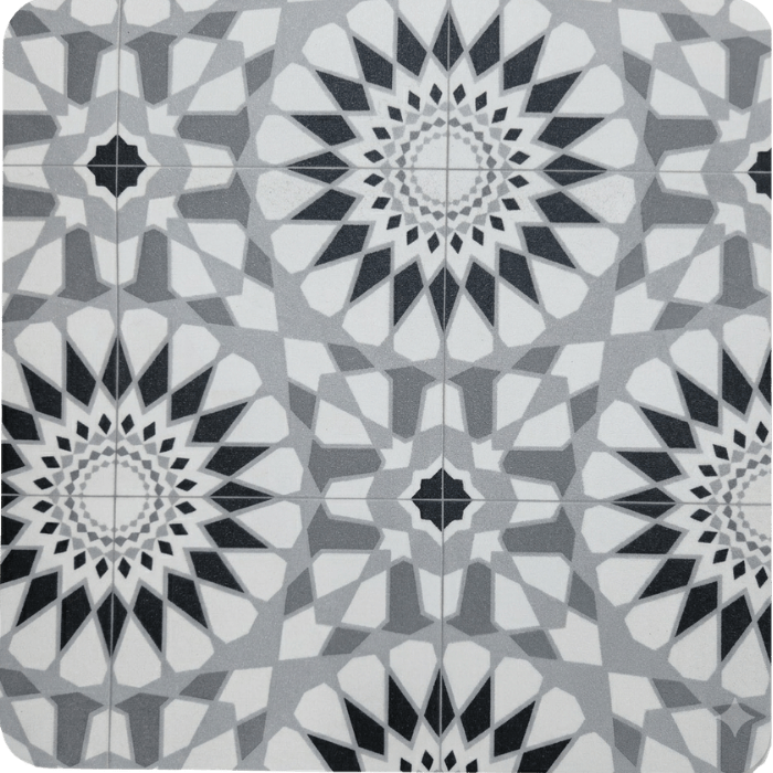 Geometric black and white tile pattern with symmetrical star and mandala designs in grayscale tones.